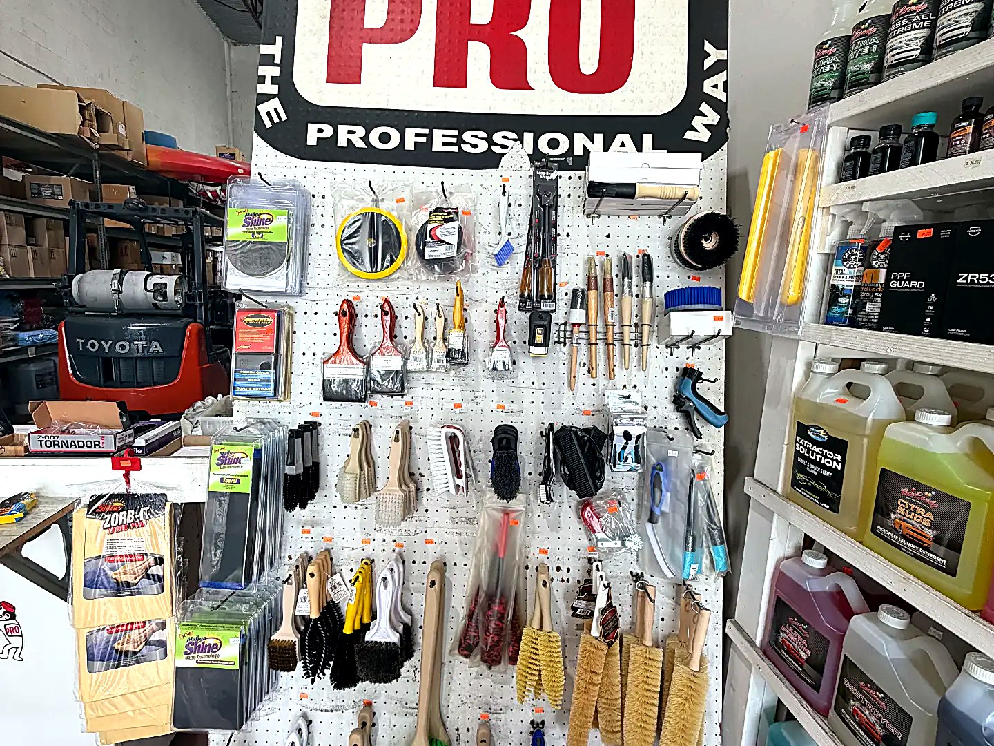 Wall display of detailing brushes and accessories inside Expert Detail Supply