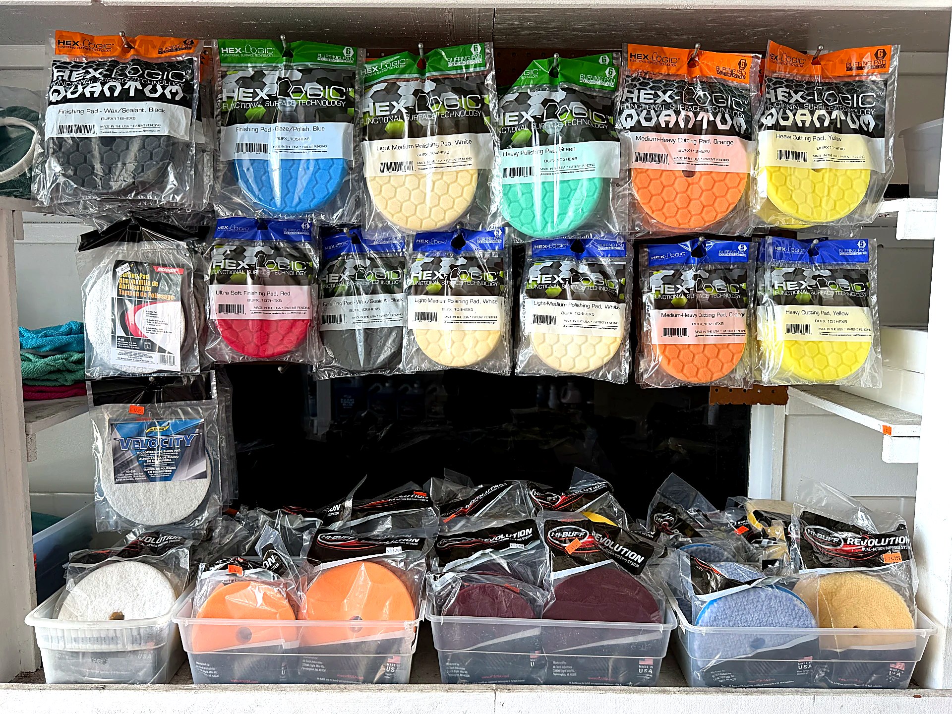 Hex-Logic and other polishing pads on display inside Expert Detail Supply